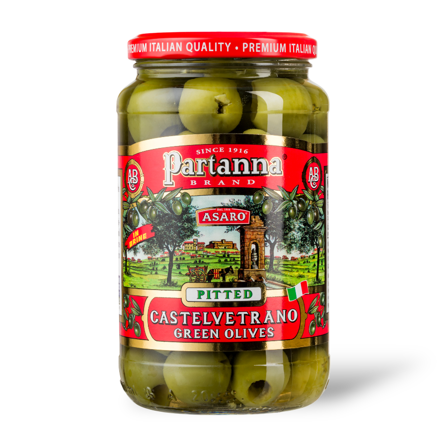 A jar of Partanna Pitted Castelvetrano Green Olives with the product label visible.