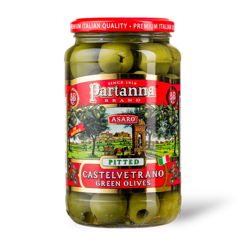 A jar of Partanna Pitted Castelvetrano Green Olives with the product label visible.