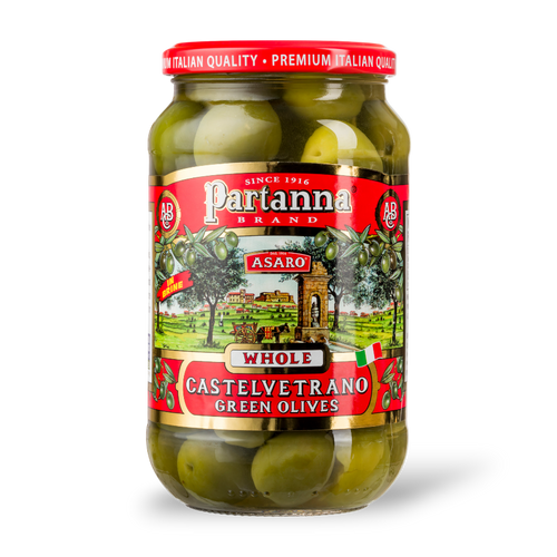 A jar of Partanna Whole Castelvetrano Green Olives with a red label, showcasing the olives and the landscape of Italy.