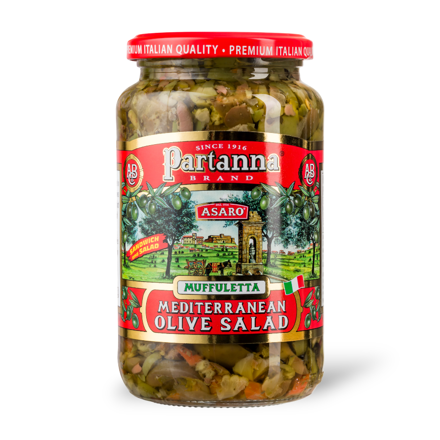 A jar of Partanna Muffuletta Mediterranean Olive Salad with a label displaying the product name and an image of a sandwich enhanced with the olive salad.