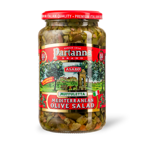 A jar of Partanna Muffuletta Mediterranean Olive Salad with a label displaying the product name and an image of a sandwich enhanced with the olive salad.
