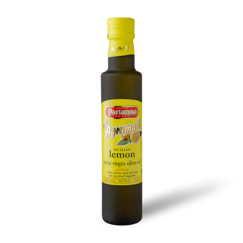 A bottle of Partanna Sicilian Lemon Extra Virgin Olive Oil with dark glass and a yellow cap, labeled with the product name and lemon graphics.