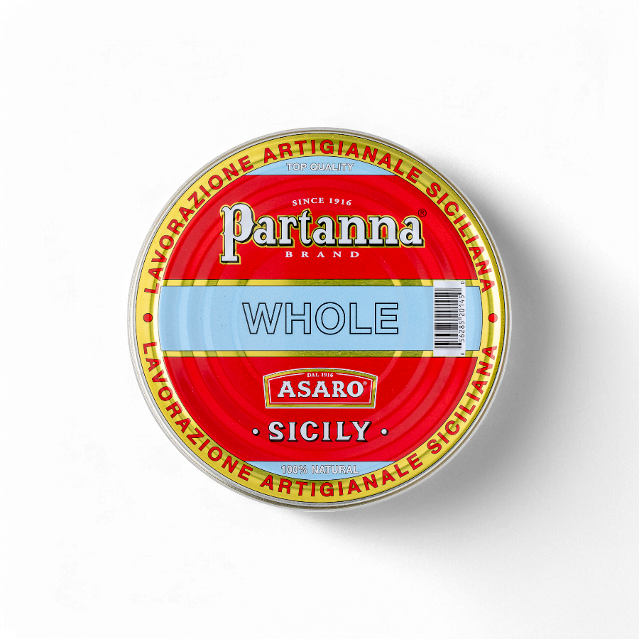 Red circular tin lid of Partanna Brand Asaro Sicilian whole olives, with gold rim text reading Lavorazione Artigianale Siciliana
