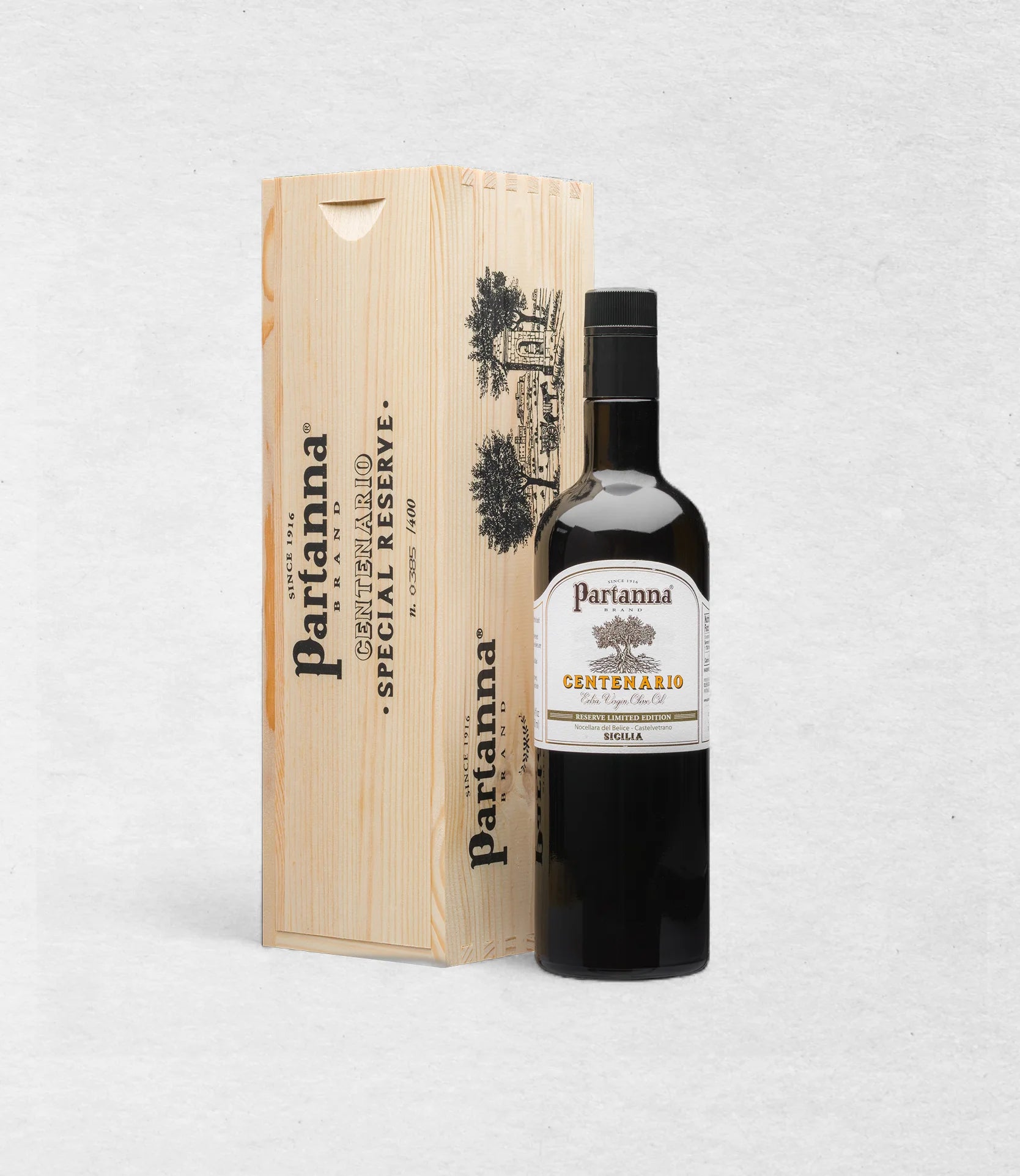 Partanna Centenario Special Reserve bottle with wooden box on a light gray background