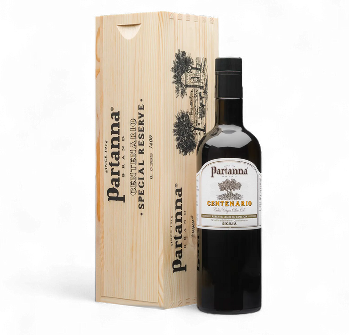 Partanna olive oil bottle with wooden box on a white background