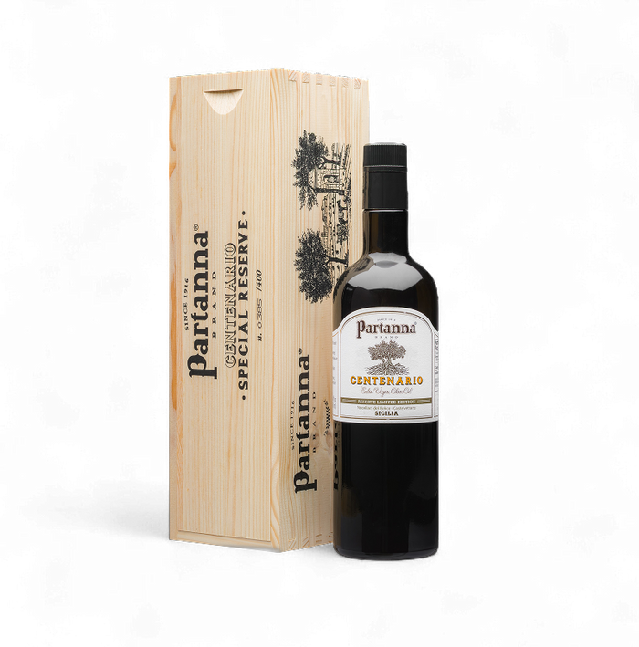 Partanna olive oil bottle with wooden box on a white background